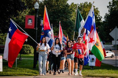 Students and community members carrying flags and parading through campus, celebrating the beginning of Latino Heritage Month on Thursday afternoon. Latino heritage month runs from September 15 to November 15 each year. (Mingda Wu | Northern Star)