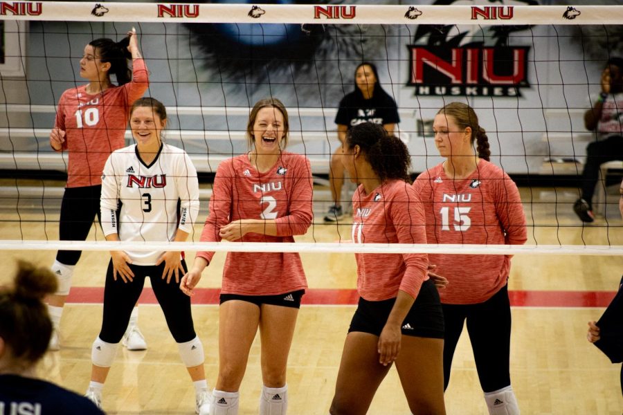 From left: Sophomore libero Francesca Bertucci, senior outside hitter Katie Jablonski, sophomore middle blocker Charli Atiemo and junior setter Ella Mihacevich prepare for a new rally against NJIT on Aug. 26. The Huskies took the match 3-0 as part of their first win at the Huskie Invitational. (Sean Reed | Northern Star)