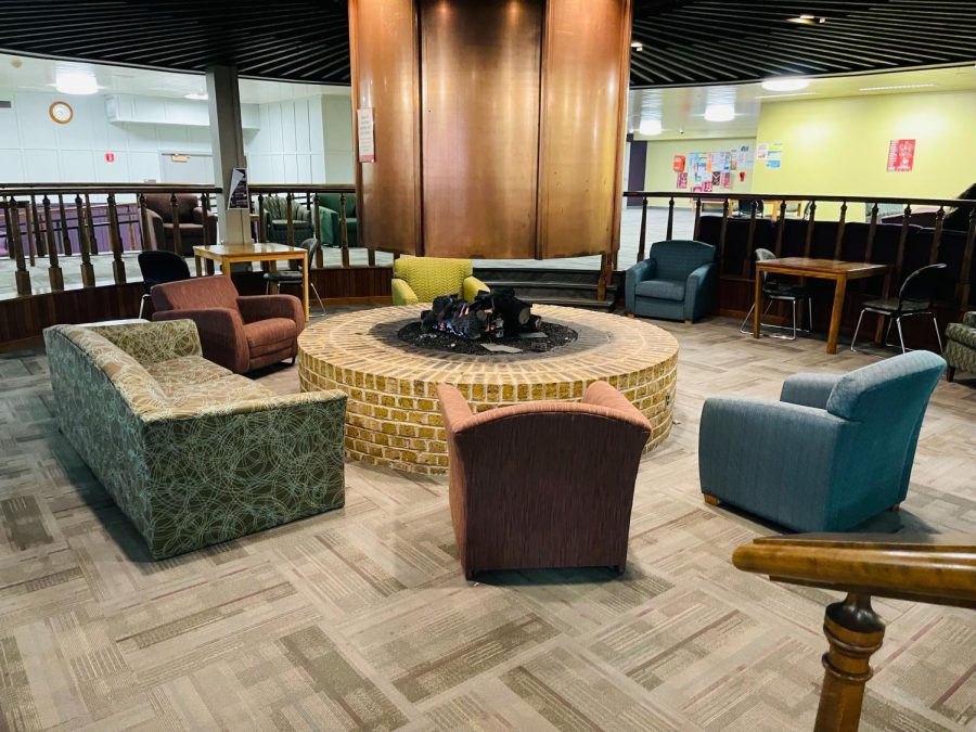 Neptune Central located in Neptune Hall has a fireplace, chairs and couches, making it a good spot to take a nap at. (Daija Hammonds | Northern Star)