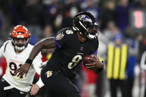 Baltimore Ravens quarterback Lamar Jackson carries the ball during the second half of an NFL football game against the Cincinnati Bengals on Sunday. Jackson was the Ravens leading rusher with 12 carries for 58 yards in a 19-17 win over the Bengals. (Nick Wass | Associated Press)