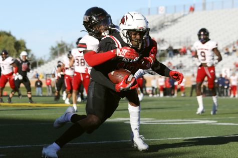 Fourth-year wide receiver Jayshon Jackson catches the football in a game against Northern Illinois Oct. 1 at Sheumann Stadium. Jackson had 10 receptions during the game. (Amber Pietz | Ball State Daily News)