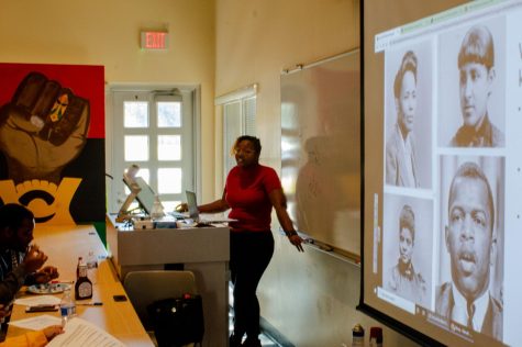 Gaylen Rivers, the assistant director of programming at the Center for Black Studies, gives a presentation for Friday afternoons So-Full Friday: The Black Vote lunch and event. (Marco Sotelo Avila | Northern Star)