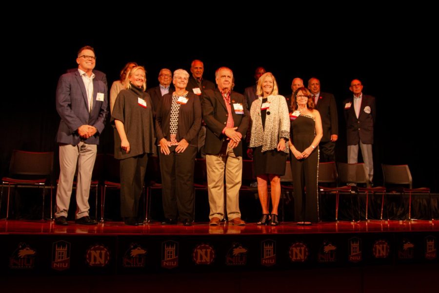 Inductees of the Athletic Hall of Fame lining the stage at the end of the ceremony. The NIU Athletics Hall of Fame induction ceremony took place on Friday night at the Duke Ellington Ballroom as part of NIUs 115th Homecoming celebratory activities. (Mingda Wu | Northern Star)