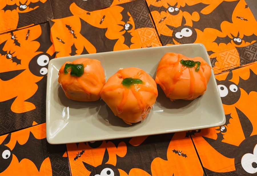 Cake balls decorated as little pumpkins are cute sweet treats to give out to friends and family this fall season. (Sarah Rose | Northern Star)