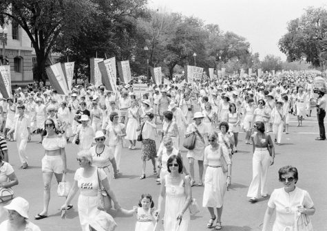 Women dressed in white and carrying suffragist banners of the last century, march to the Capitol in Washington D.C., July 9, 1978. The group urged Congress to extend the time for ratification of the Equal Rights Amendment.
