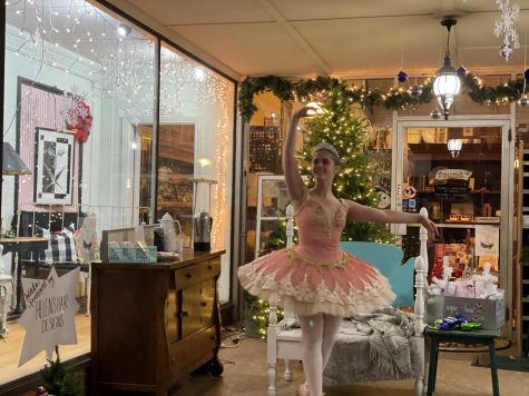 A dancer from Dimensions Dance Academy performing in 2021 in a DeKalb business window. (Courtesy of Dimensions Dance Academy)