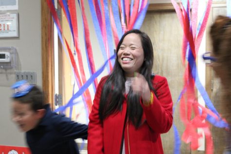 County clerk candidate Linh Nguyen being greeted by supporters  as she arrives at the DeKalb County Democrats election watch party on Tuesday. (Nyla Owens | Northern Star)