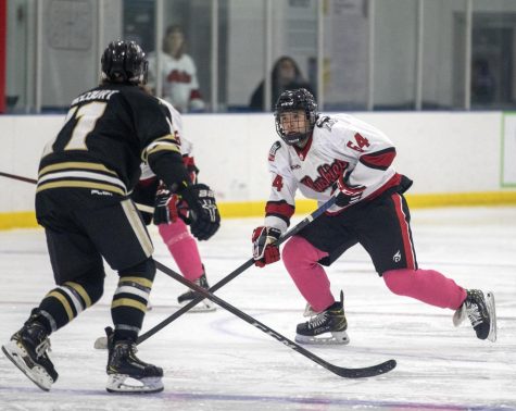 NIU freshman forward Cam Pathana handles the puck against a Purdue University Northwest player during a hockey game on Oct. 14 at Canlan Ice Sports in West Dundee. (Beverly Buchinger | NIU Hockey)