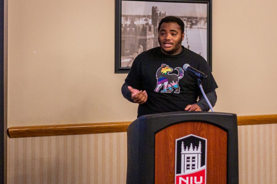 Trevon Smith, president of the on-campus group Prism, giving a speech to memorialize the lives of trans people who have passed due to violence on Tuesday at the skyroom in Holmes Student Center. (Mingda Wu | Northern Star)