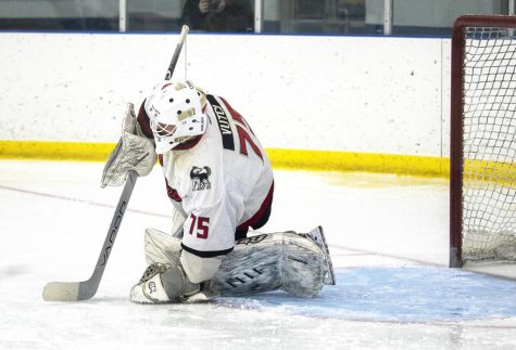 NIU junior goaltender Ben Vutci kneels on the ice during a game against Midland University on Oct. 14. Vutci surrended four goals in NIUs home matchup with the Waldorf University Warriors on Friday, resulting in him getting pulled in the first period in favor of freshman goaltender Jacob Piros (Beverly Buchinger | NIU Hockey)