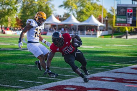 Sophomore running back Harrison Waylee runs out of bounds during NIU’s loss to the University of Toledo in the 115th Homecoming Game on Oct. 8 at Huskie Stadium. Waylee rushed for 899 yards in 2022. (Sean Reed | Northern Star)