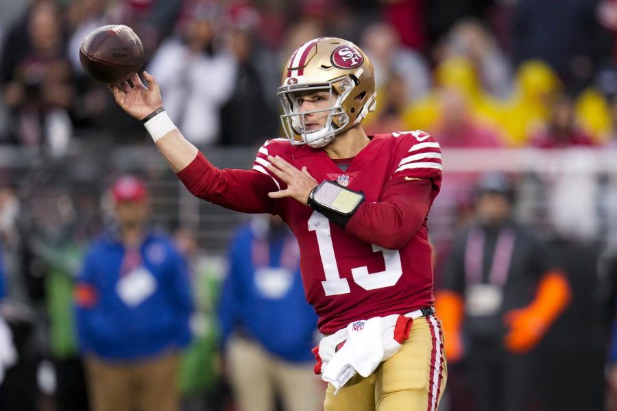San Francisco 49ers quarterback Brock Purdy (13) passes against the Seattle Seahawks during the second half of an NFL wild card playoff football game in Santa Clara, Calif., Saturday, Jan. 14, 2023. (AP Photo/Godofredo A. Vásquez)