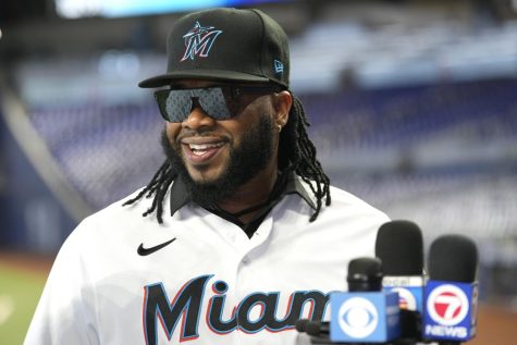 Pitcher Johnny Cueto speaks with the news media after signing a contract with the Miami Marlins baseball team, Thursday, Jan. 19, 2023, in Miami. Cueto signed a one-year contract with the Marlins with a club option for 2024. (AP Photo/Lynne Sladky)
