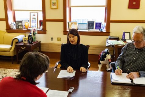 NIU President Lisa Freeman (center) discussing student involvement in NIUs Greek Life beside Associate Director for Institutional Communications, Joe King, during her meeting with the Northern Star on Monday at her office in Altgeld Hall. (Sean Reed | Northern Star)