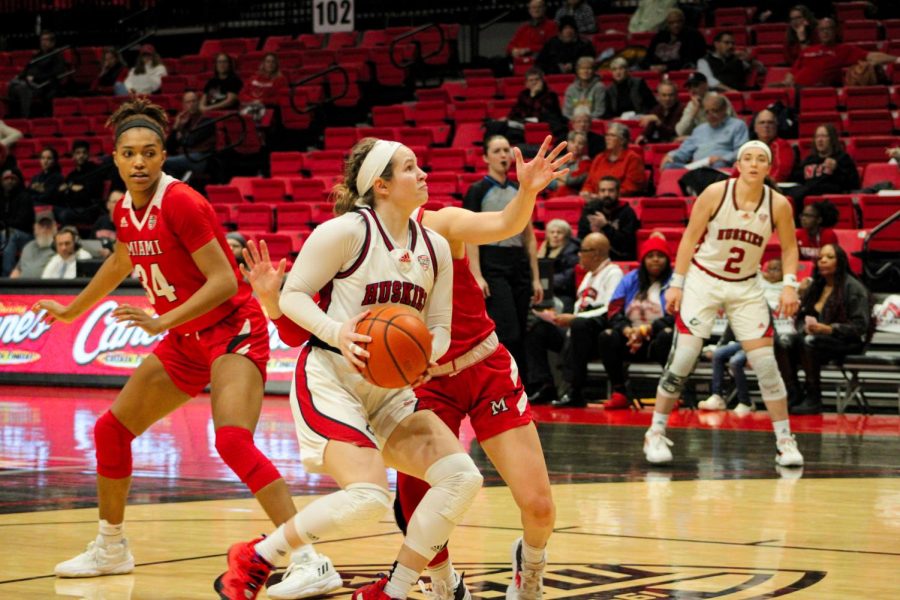NIU senior guard Chelby Koker drives to the basket as Miami University senior guard Peyton Scott defends during the Huskies’ home game against the RedHawks on January 18, 2023 at the NIU Convocation Center. Miami prevailed in a 74-69 contest. (Nyla Owens | Northern Star)