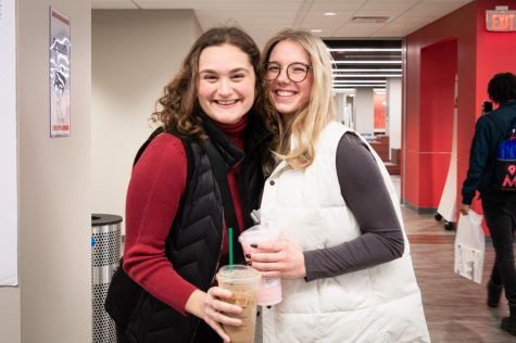 Alyssa Caldern (left), a junior studying early childhood education, and Jojo Rojas, a sophomore studying business administration, spend part of their last day of winter break at Holmes Student Center. (Mingda Wu | Northern Star)