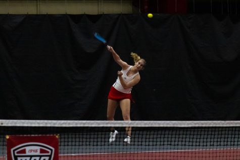 NIU sophomore tennis player Reagan Welch during a doubles match on Jan. 14 against University of Iowa players on the fourth court at Nelson Tennis Center. (Sean Reed | Northern Star)