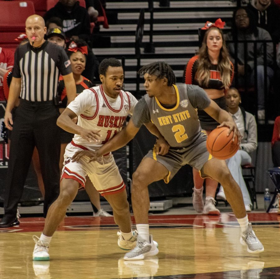 NIU sophomore guard David Coit (11) defends against Kent State University redshirt senior guard Malique Jacobs during an NCAA basketball game Tuesday night at the NIU Convocation Center in DeKalb. (Tim Dodge | Northern Star)