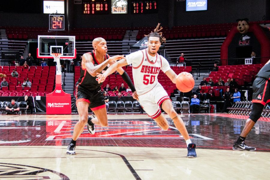 NIU+redshirt+senior+guard+Anthony+Crump+%2850%29+drives+against+Ball+State+redshirt+sophomore+forward+Mickey+Pearson+Jr.+%283%29+during+the+first+half+of+an+NCAA+basketball+game+at+the+Convocation+Center+in+DeKalb.+%28Mingda+Wu+%7C+Northern+Star%29