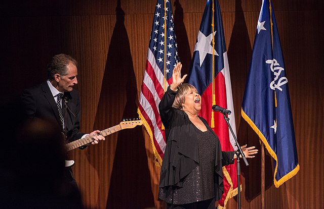 Mavis Staples, Grammy Award-winning singer and civil rights activist, and guitarist Rick Holmstrom perform We Shall Overcome before President Obamas keynote speech at the Civil Rights Summit on April 10, 2014.