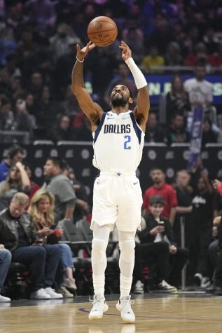 Dallas Mavericks guard Kyrie Irving tosses the ball in the air just prior to tip-off in an NBA basketball game against the Los Angeles Clippers Wednesday, Feb. 8, 2023, in Los Angeles. (AP Photo/Mark J. Terrill)