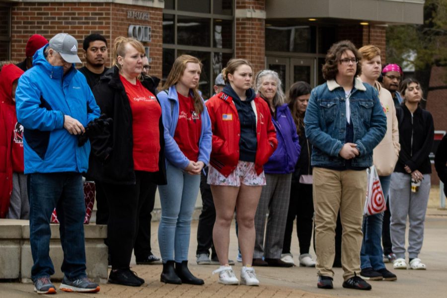 Family members and friends of victims of the 2008 shooting, alongside NIU community members, stand together as a crowd during the 15-year memorial, held at 3:06 p.m. as the bells of the Holmes Student Center echoed through campus. (Sean Reed | Northern Star)