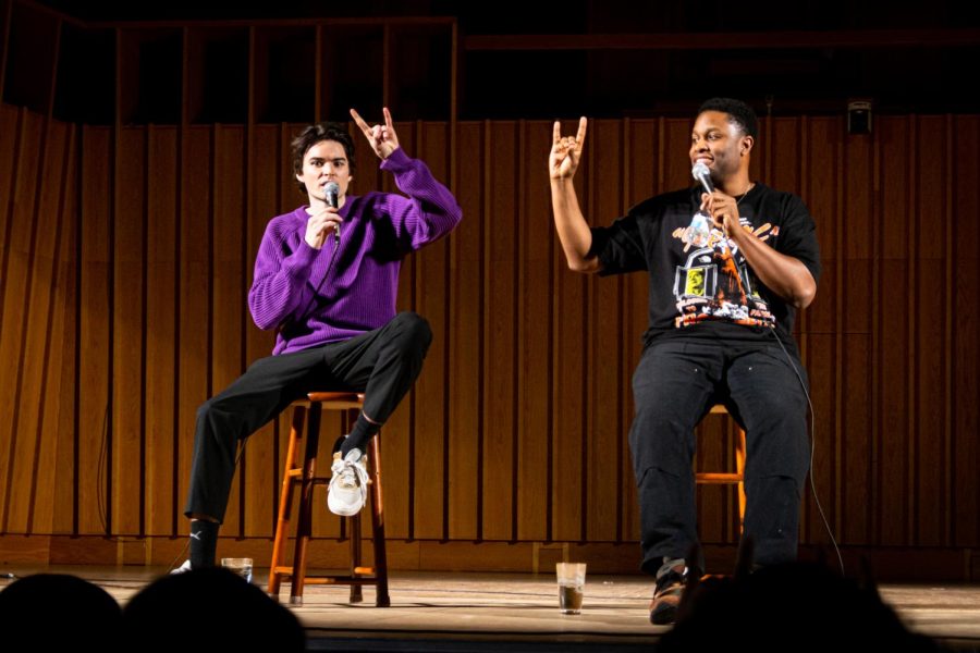 Saturday Night Live cast members Michael Longfellow (left) and Devon Walker (right) showing the posture meaning “Go Huskies” as the reaction to the audience’s requirement in the last 20 minutes of the comedy show on Wednesday night at Boutell Memorial Concert Hall in the Music Building. (Mingda Wu | Northern Star)