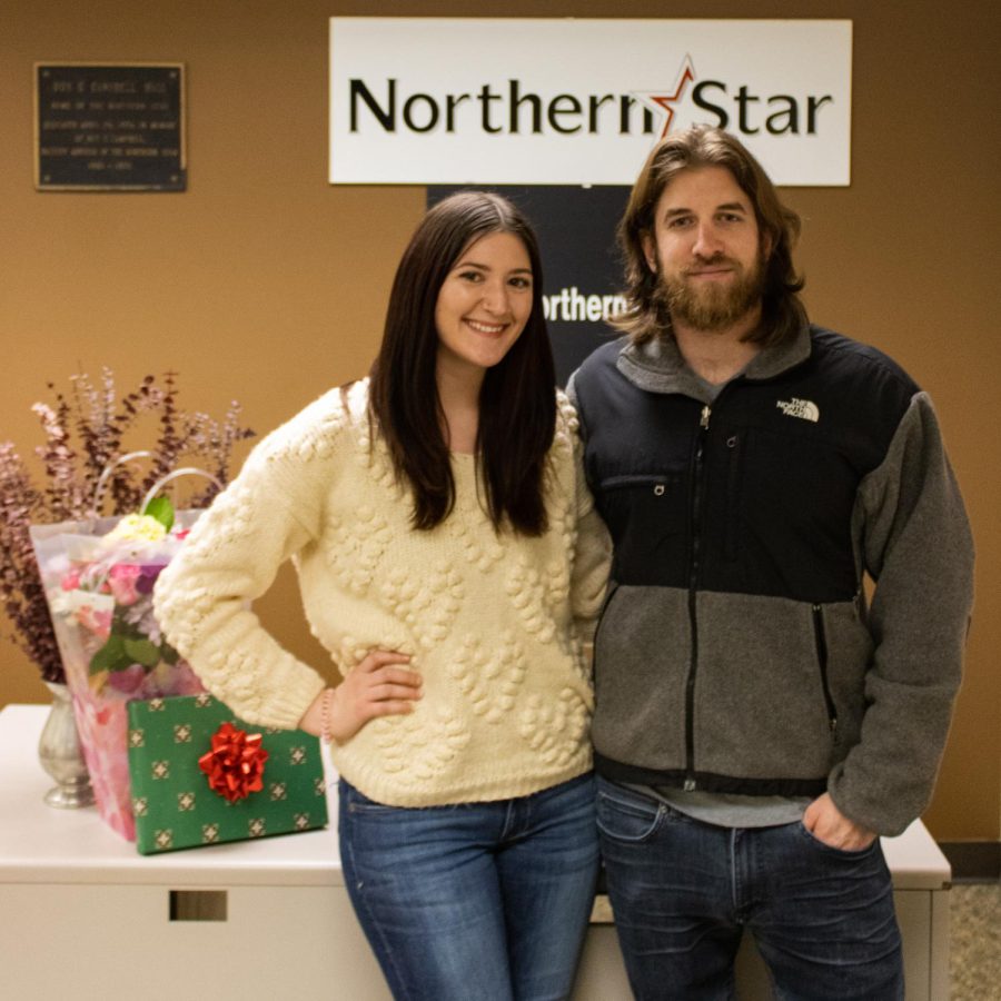 ‘Meet-cute’ contest winners Cecilia Lucente and Nicholas Duka stand beside their prizes received on Monday at the Northern Star office. (Sean Reed | Northern Star)