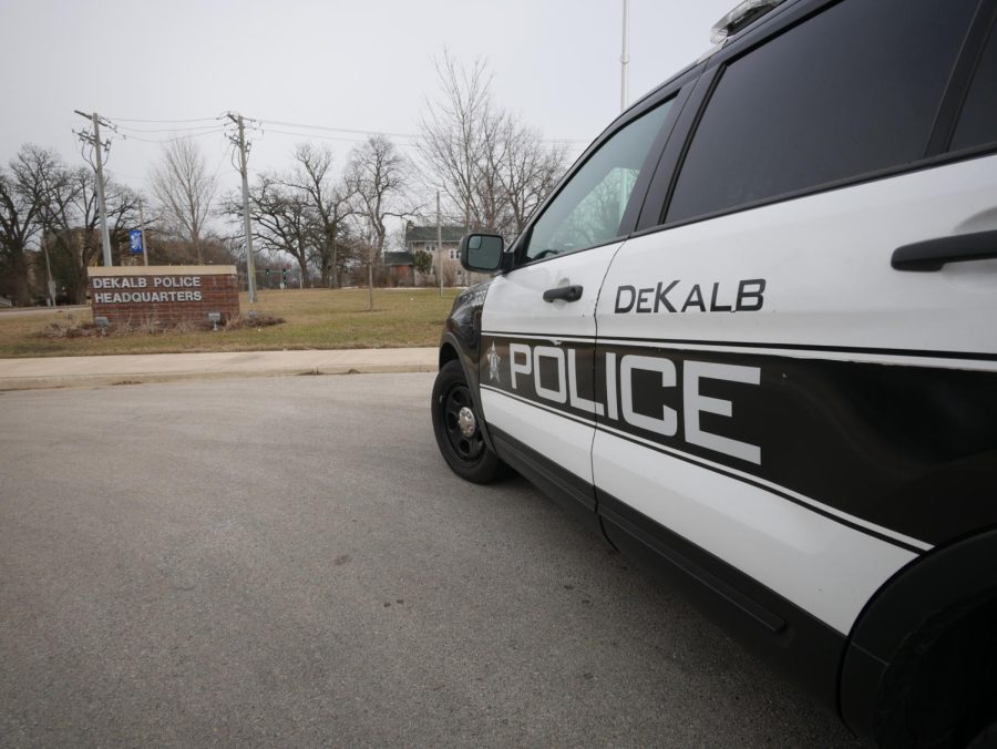 A DeKalb Police car sits parked on an overcast afternoon in front of the citys Police Headquarters.