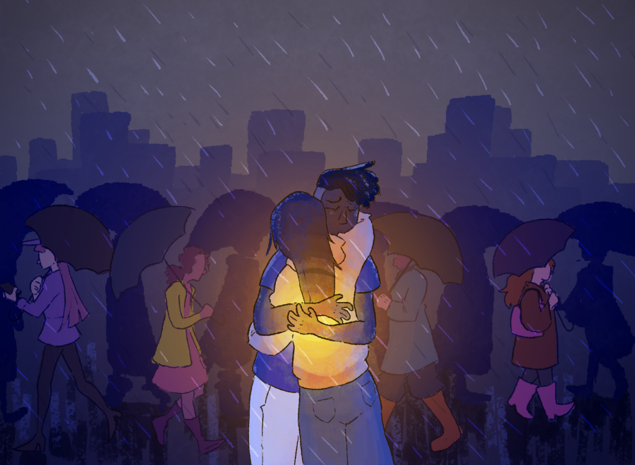 Two people hugging as others walk by on a rainy and gloomy day. With traumatic events constantly happening, remember to take care of yourself and those around you. 