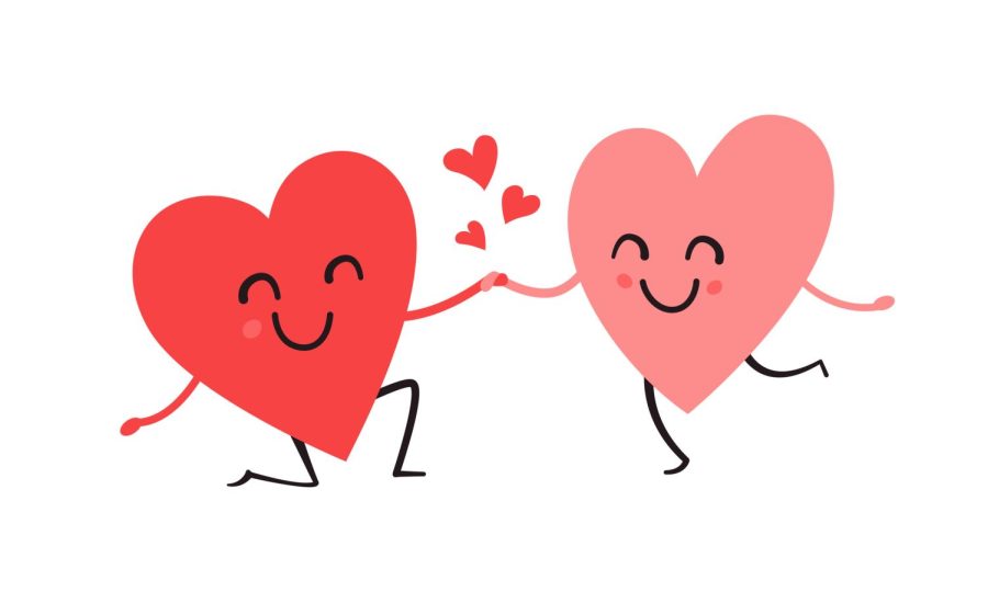 A pink and red heart characters holding hands.  Columnist Angelina Padilla-Tompkins believes that everyone should celebrate Valentines Day no matter your relationship status. It is a day for love for anyone. 