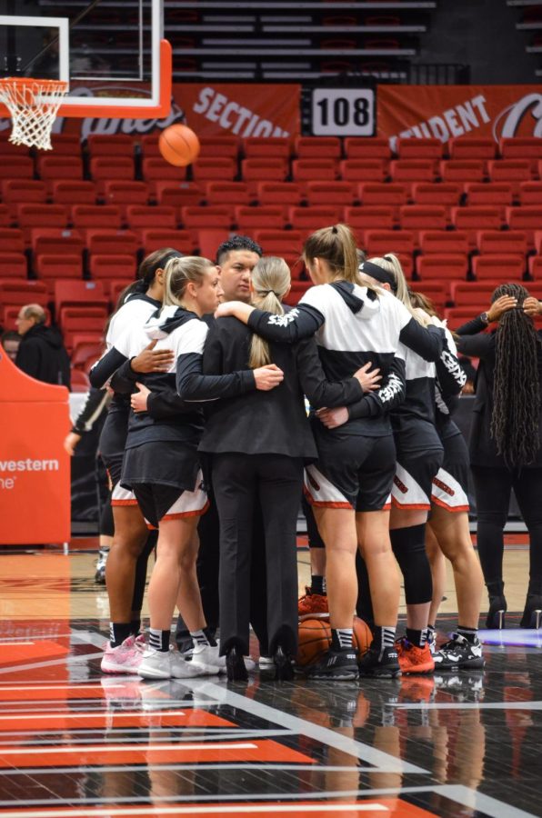 NIU womens basketball team huddled in a circle before the game on Feb. 18, 2023 against Ball State.  The Huskies defeated the University of Central Michigan on Saturday by a final score of 70- 57. (Northern Star file photo)