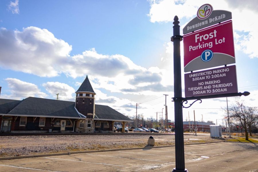 Downtown DeKalb’s Frost Parking Lot rests empty on Friday at East Locust and Sixth Street. A new city ordinance will allow DeKalb commuters to park after 5 a.m. and take the 12 line bus to the Elburn train station. (Sean Reed | Northern Star)