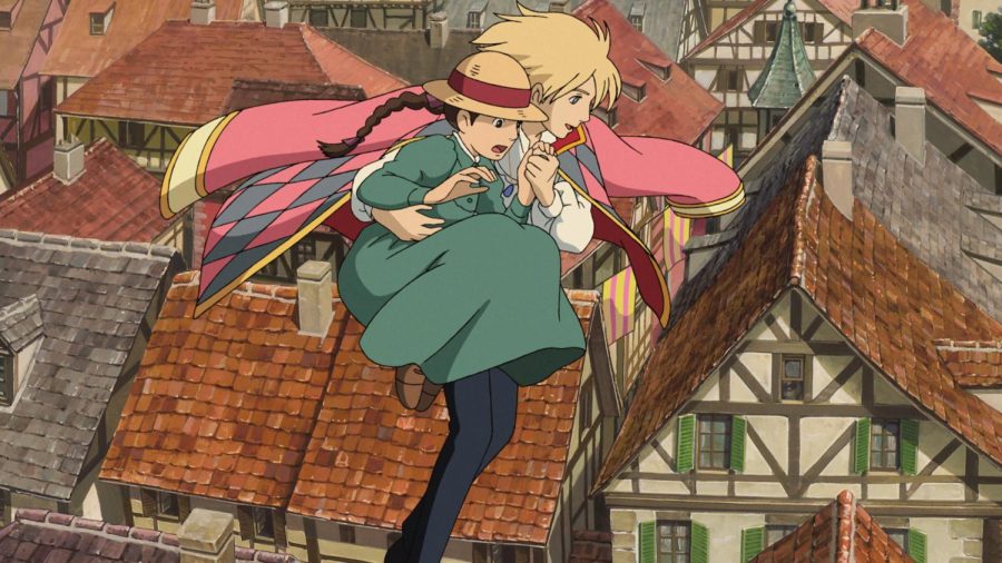 Howl and Sophie from the film Howls Moving Castle flying over a village. Studio Ghiblies 2004 release Howls Moving Castle is one of the five films featured on this list of the top five Studio Ghibli films © 2004 Studio Ghibli - NDDMT