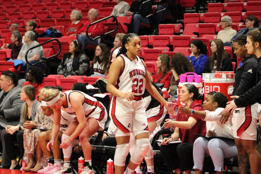 Huskies+guard+Janae+Poisson+%2822%29+high+fives+her+teammates+before+a+timeout+during+the+teams+game+against+Eastern+Michigan+on+Wednesday+at+the+NIU+Convocation+Center.+Poisson+earned+an+NIU+record+for+the+most+double+doubles+in+a+career+with+the+team+during+the+game+and+the+Huskies+clinched+a+seeding+in+the+MAC+Basketball+Championship+bracket.+%28Nyla+Owens+%7C+Northern+Star%29
