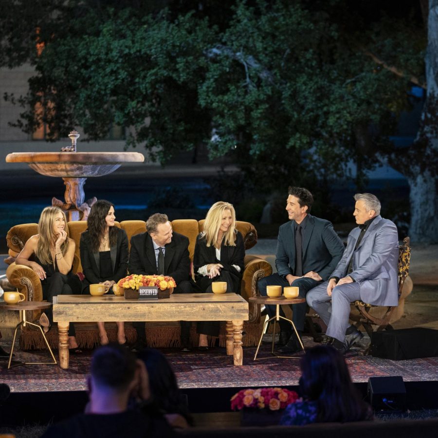 Friends actors (left) Jennifer Aniston, Courteney Cox, Matthew Perry, Lisa Kudrow, David Schwimmer and Matt LeBlanc sitting in a park during Friends: The Reunion. The group was asked if Ross and Rachel were on a break during this conversation. 
