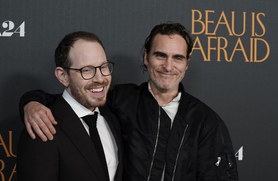 (from left) Ari Aster and Joaquin Phoenix pose together at the premiere of the film Beau Is Afraid. The movie will release in theaters next Friday. (AP Photo | Chris Pizzello)