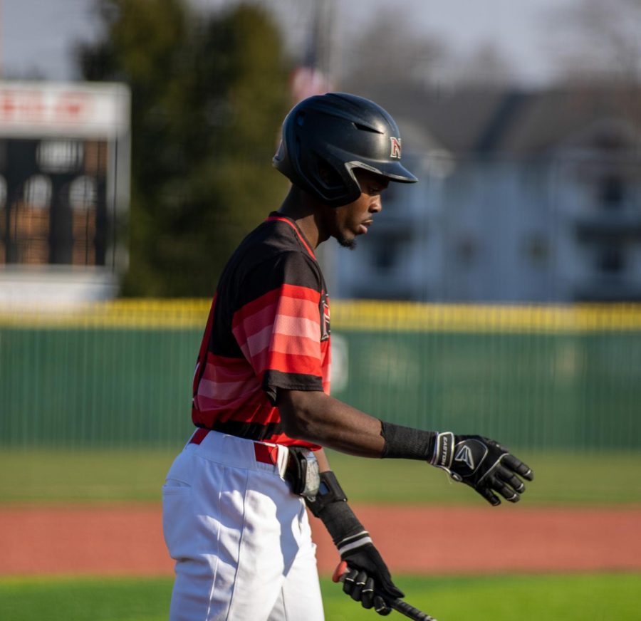 NIU senior center fielder Malik Peters (31) walks up to bat at the bottom of the ninth inning Friday. The Huskies lost to CMU 7-0 for the mid-afternoon game on April 7. (Tim Dodge | Northern Star)
