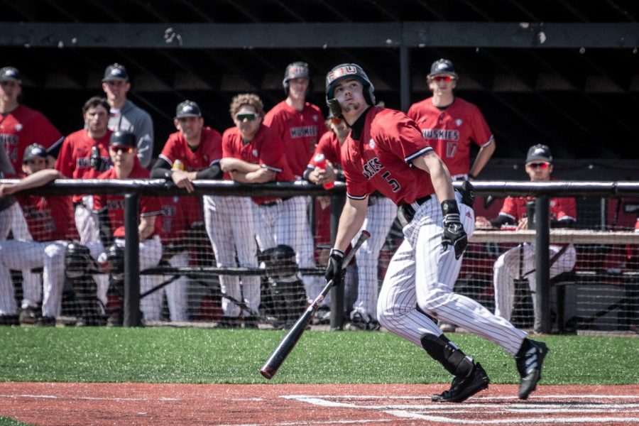 NIU junior right fielder Eric Erato (5) watches the ball fly up, singling to shortstop after hitting it in the bottom of the sixth inning on April 8. The Huskies lost to CMU for the second of their three game series Saturday 17-7. (Mingda Wu | Northern Star)
