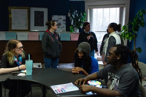 NIU students and staff sit together, bonding over shared experiences concerning their gender identities Friday at the GSRC. (Cheyanne Quintanilla | Northern Star)