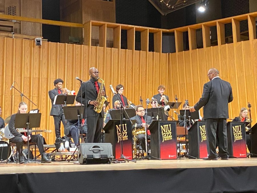 Director Reggie Thomas leads the NIU jazz orchestra. The orchestra performed Thursday at the Boutell Memorial Concert Hall. (Eli Tecktiel | Northern Star)