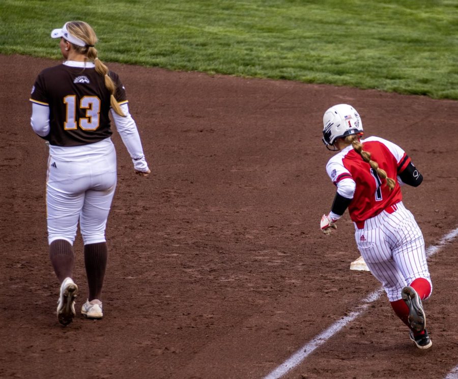  Freshman outfielder Ally Rodriguez (1) runs to first base after hitting a single during the third inning. The Huskies lost the game 7-6. (Tim Dodge | Northern Star) 

