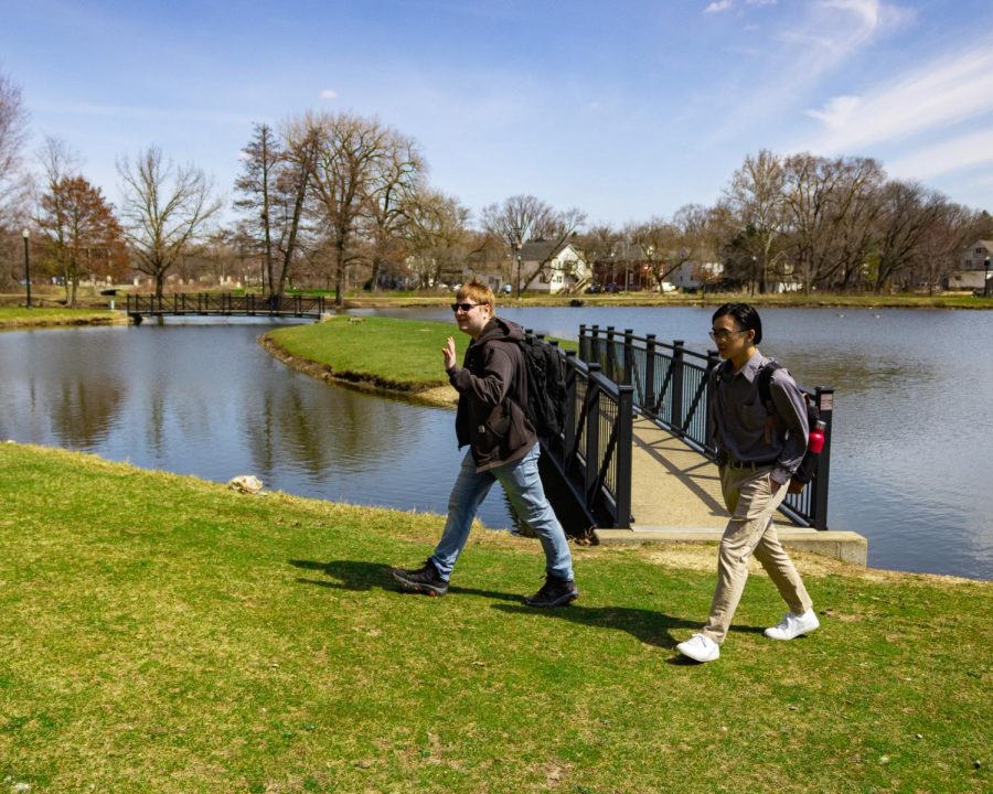 Then-sophomore geography major Martin Astter (left) and then-junior applied mathematics major Dylan Ruan walk by the lagoon on a sunny day. Students can participate in Student Wellness’ Spring Into Wellness week, which offers activities and resources aimed at promoting mental health, reducing stress and building healthy habits. (Northern Star File Photo)
