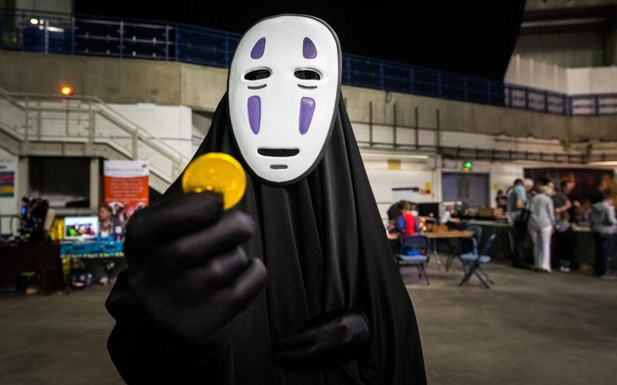 A cosplayer dressed as the character No Face from the Studio Ghibli film Spirited Away at the Yorkshire Cosplay Convention at Sheffield Arena. No Face is a character from Spirited Away: Live on Stage which is now showing in select theaters.