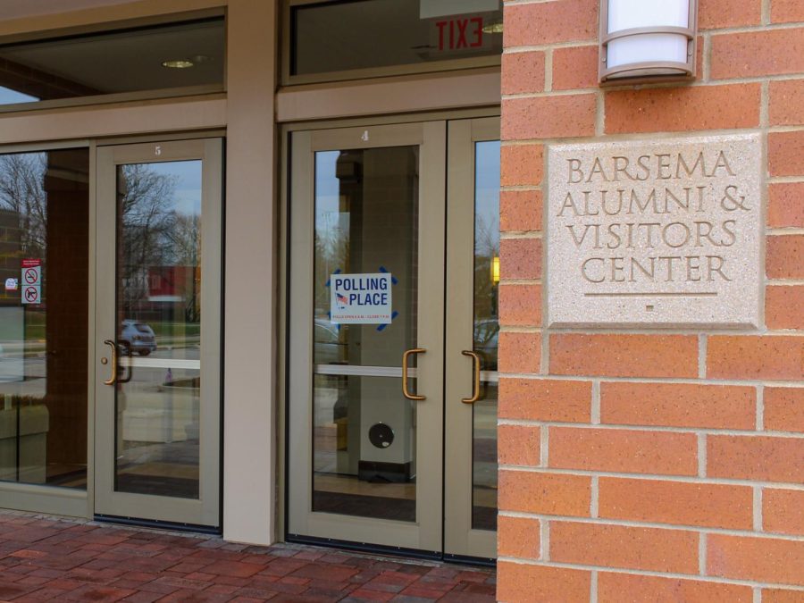 A sign denoting a polling location hangs from the door of Barsema Alumni and Visitors Center, the on-campus polling location for the consolidated election Tuesday in DeKalb. The election saw a 10% turnout for registered voters in DeKalb County. (Nyla Owens | Northern Star)