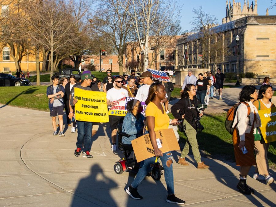 Students marching toward MLK Commons on campus. DREAM Action NIU held its 10th annual Coming Out of the Shadows event on April 12. (Sean Reed | Northern Star)