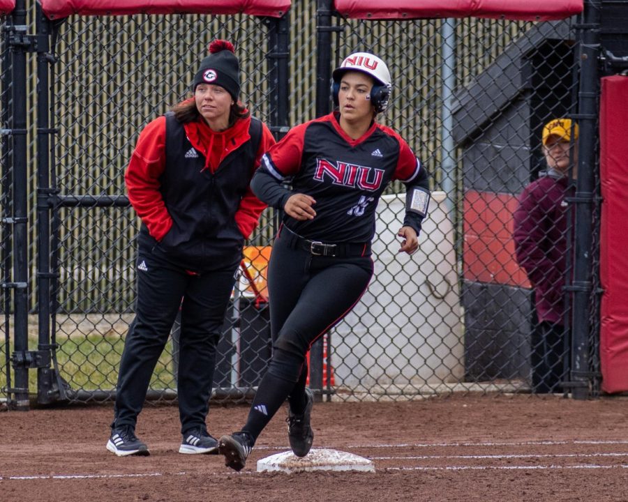 Senior+second+baseman+Sam+Mallinder+%2818%29+rounds+first+base+Saturday.+Mallinder+spoke+to+her+experience+in+being+recruited+and+playing+at+NIU%2C+her+goals+for+the+team+and+her+education.+%28Tim+Dodge+%7C+Northern+Star%29