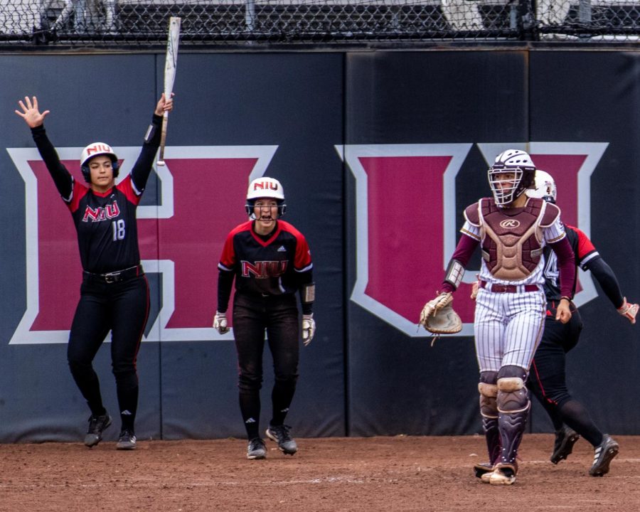 Huskie+second+baseman+Sam+Mallinder+%2818%29+and+freshman+outfielder+Ally+Rodriguez+%281%29+scream+and+cheer+as+CMU+redshirt+senior+catcher+Samantha+Mills+%283%29+walks+in+to+the+dugout+at+the+end+of+their+game+on+April+1.+%28Tim+Dodge+%7C+Northern+Star%29