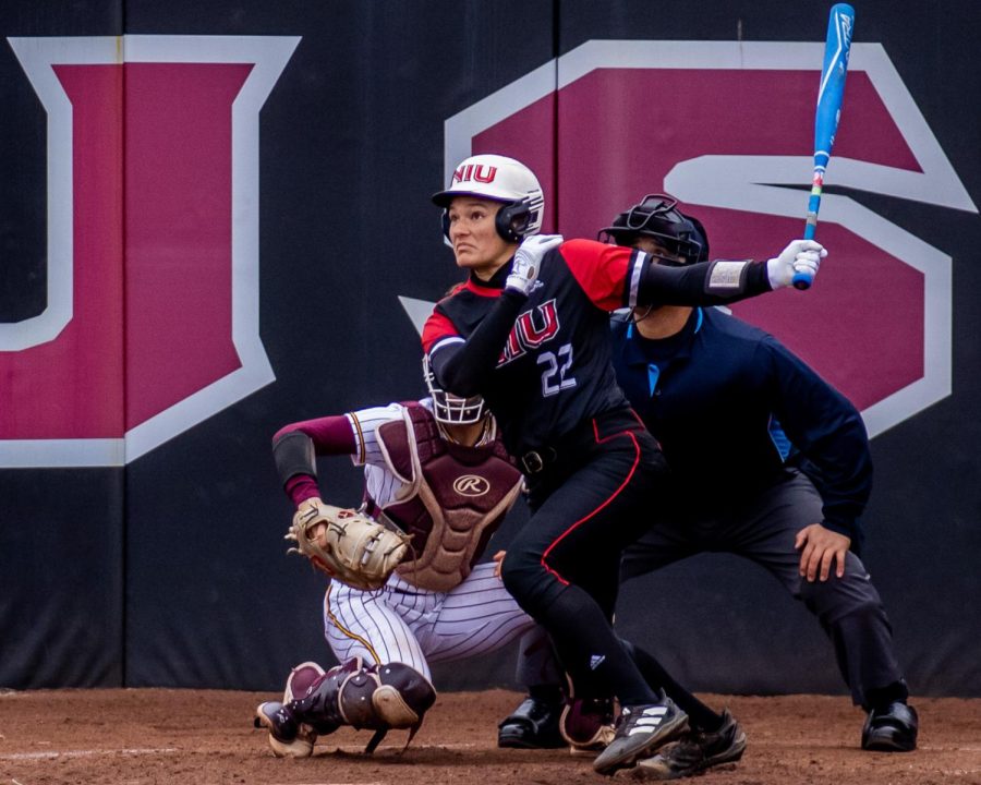 NIU+freshman+utility+player+Danielle+Stewart+%2822%29%2C+at+bat%2C+watches+the+ball+fly+after+swinging+during+the+Huskie+Softball+game+against+Central+Michigan+University+on+April+1+at+Mary+M.+Bell+Field+in+DeKalb.+%28Tim+Dodge+%7C+Northern+Star%29
