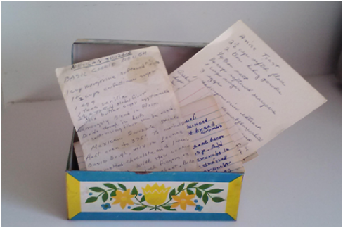 Three handwritten cards with recipes on them sit in a yellow and blue box. The Culinary Historians of Northern Illinois will be joining the DeKalb County History Center for one of the many new programs and exhibits at the History Center. (Courtesy of the DeKalb County History Center)